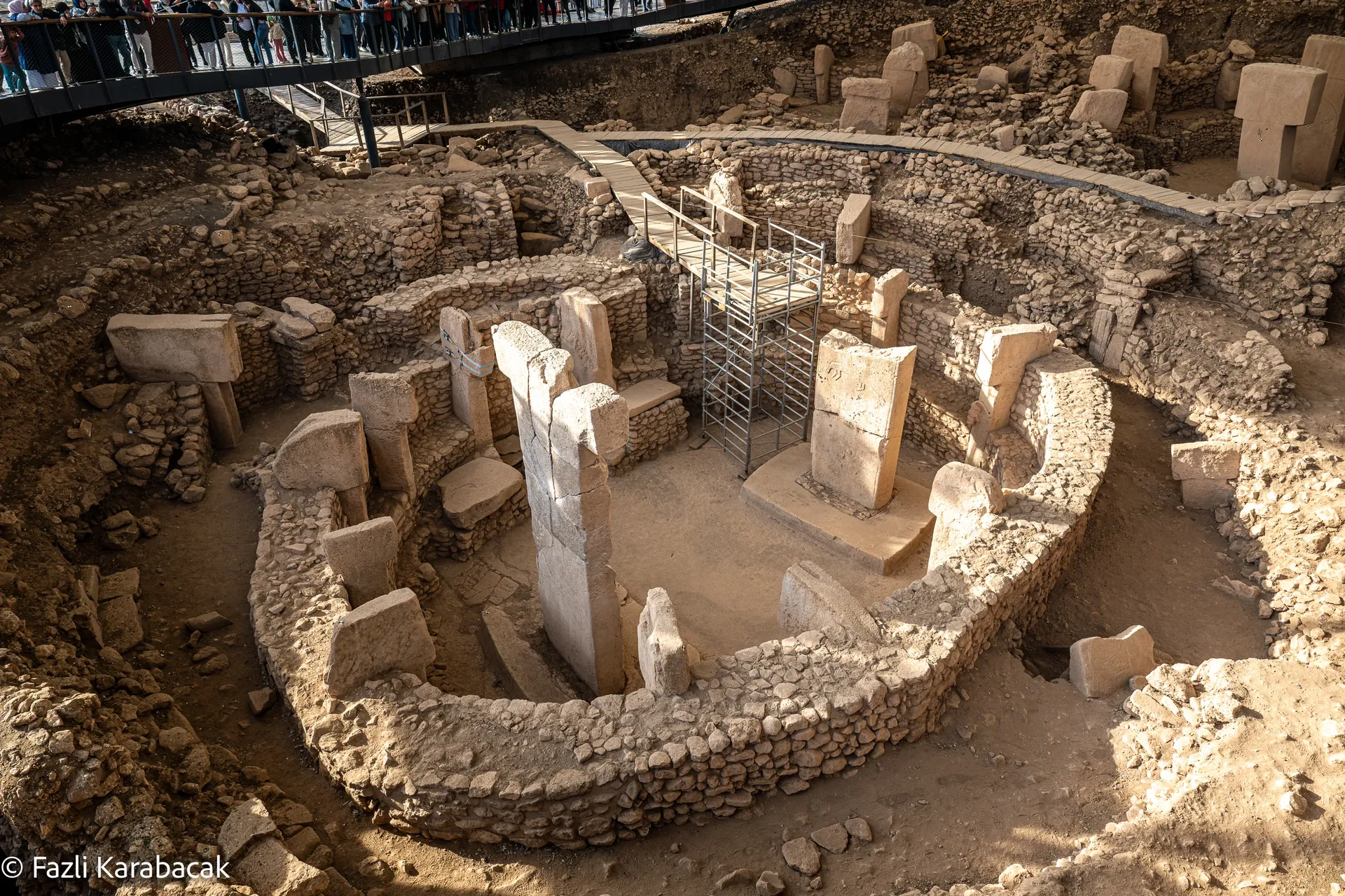 Elevated view of Göbekli Tepe mound with protective shelter and surrounding landscape