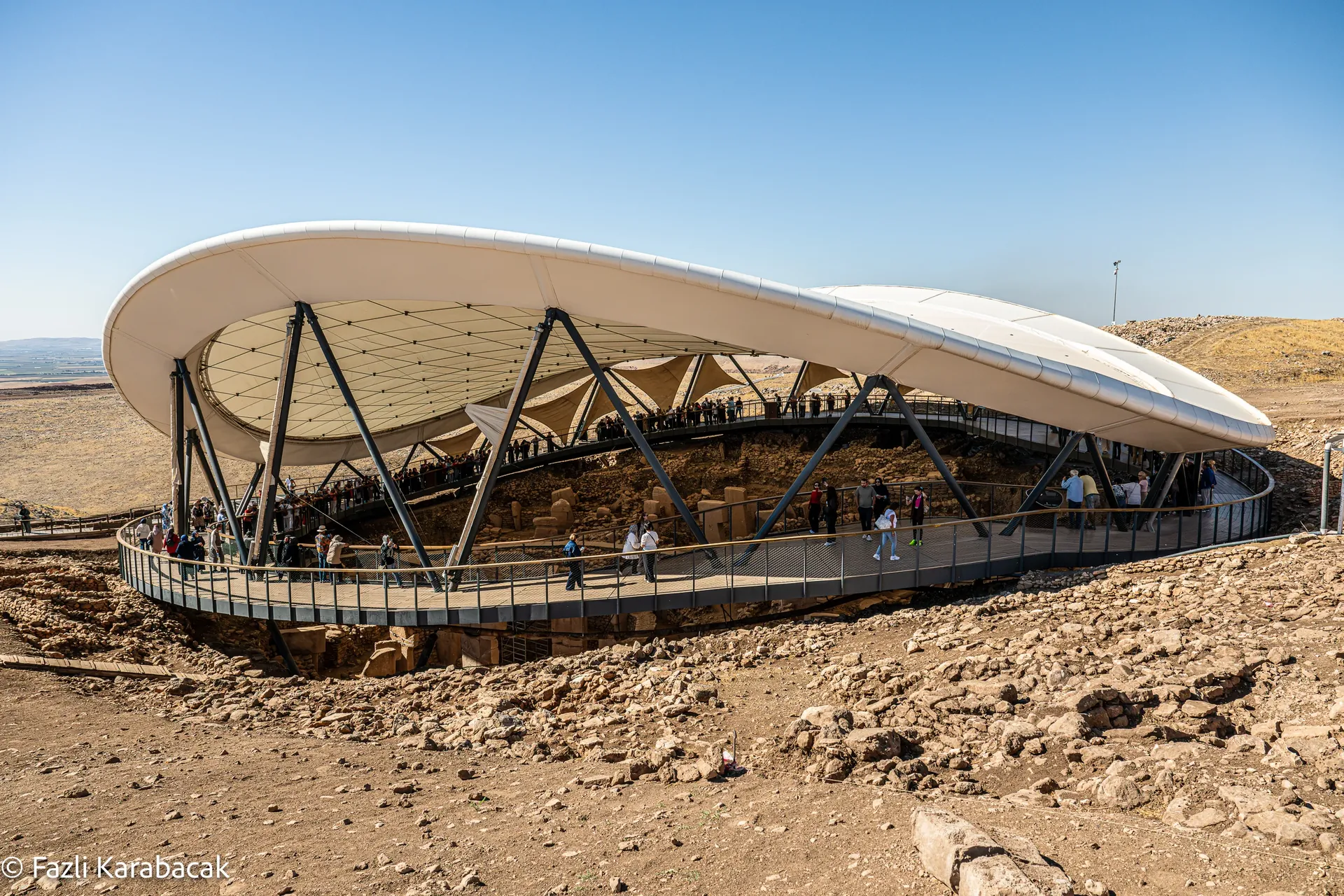 The hilltop mound of Göbekli Tepe, viewed from the southeast, with the modern shelter protecting Enclosures C and D